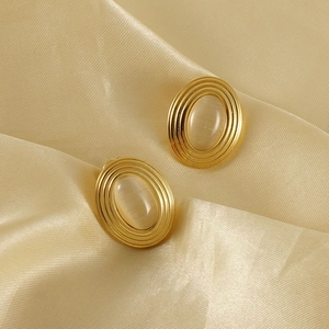Vintage 18K gold-plated oval stud earrings with natural cat eye stone on silk fabric