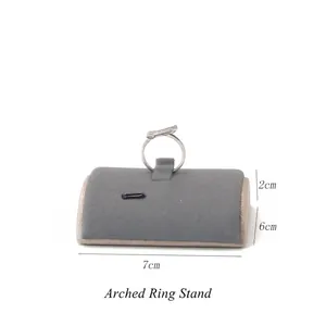 Detailed macro view of a grey velvet curved ring display stand measuring 7x6x2cm