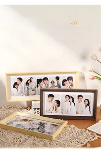 Detail of minimalist solid wood multi-photo frames featuring natural grain and warm textures