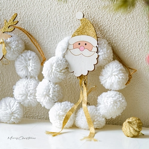 Plush Christmas wreath with wooden Santa pendant and golden ribbon for festive door decor