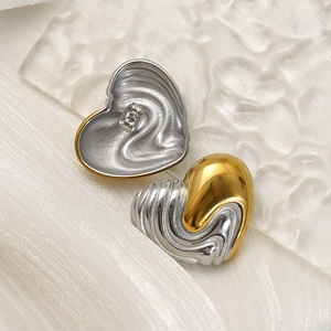 Two-tone gold and silver heart stud earrings with fluid wave texture in stainless steel