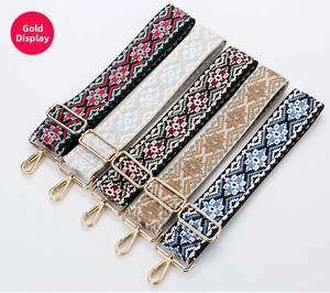 Detailed display of five colorful ethnic embroidered canvas straps with gold metal hooks
