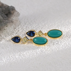 Elegant gold drop earrings with teardrop blue zircon and turquoise in a vintage style