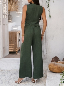 Detail view of dark green linen texture sleeveless top and wide-leg pants from the back