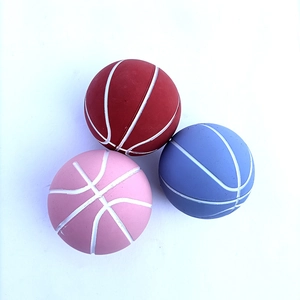 Three mini high-bounce basketball stress balls in red, pink, and blue on a white background