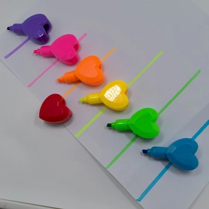 Set of six heart-shaped mini highlighters in vibrant pastel colors on white paper
