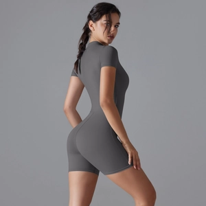 Detail of dark grey short sleeve yoga bodysuit with zipper and slim fit athletic fabric