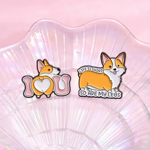 Cute corgi enamel pin set with heart shape and funny quote on a pink display tray