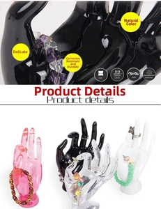Detailed view of hand-shaped jewelry stands in various colors for ring and bracelet display