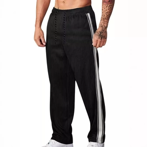 Pantalon de jogging pour homme en velours côtelé noir avec rayures blanches latérales
