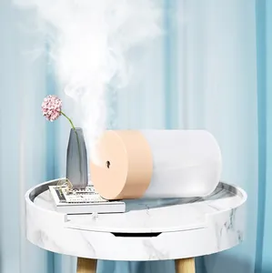 Minimalist USB portable air humidifier in pink color shown on marble table with leak-proof design