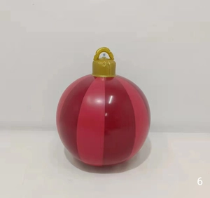 Close-up of 60cm red striped inflatable Christmas ball with golden hanging ring and air valve