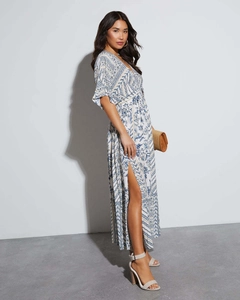 Detail view of bohemian V-neck floral maxi dress with side slit and summer print
