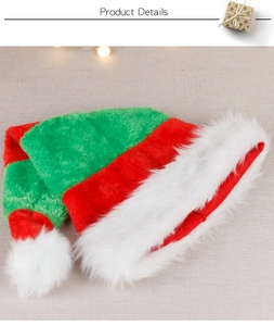 Detailed view of red and green striped Christmas hat with plush faux fur trim and white pom-pom