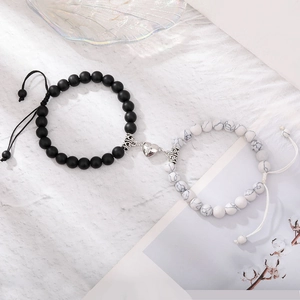 Detail of magnetic heart clasp on natural tiger eye stone couple beaded bracelets