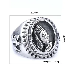 Detail view of punk prayer hands ring with dimensions 31mm by 28mm and 21.97g weight