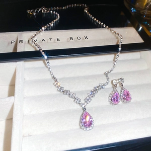 Exquisite luxury jewelry set with pink teardrop diamonds in a premium gift box