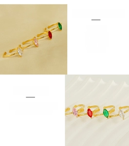 Dettaglio di anelli regolabili in acciaio inossidabile con zirconi marquise in quattro colori