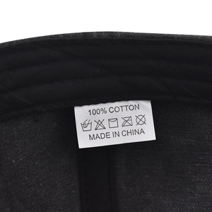 Detailed close-up of 100% cotton wash label and inner stitching on the baseball cap