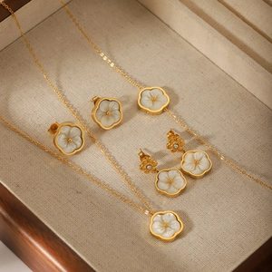 Luxury gold stainless steel floral jewelry set with shell petals and zircon crystals