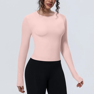 Haut de yoga rose à manches longues, coupe ajustée en tissu stretch respirant