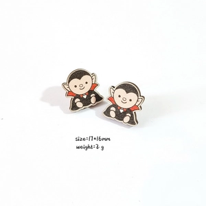 Detail view of wooden vampire bat earrings with dimensions 17x16mm and weight 2g
