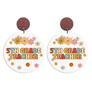 Detail of wooden bohemian earring with vintage 5th Grade Teacher text print