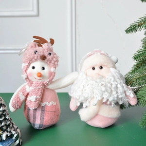 Pink plush Christmas gnome and reindeer snowman dolls for festive holiday tabletop decor