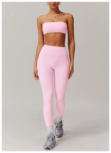Detail of pink strapless sports bra and high waisted yoga leggings set with seamless fabric