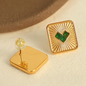 Golden square earrings with green heart-shaped gemstones and radial metal texture for women