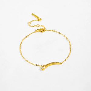 Close-up of gold S925 silver bracelet with teardrop crystal and adjustable chain detail