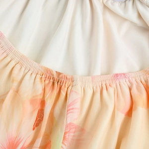 Detailed macro view of pink floral mesh fabric with elastic ruching and soft lining