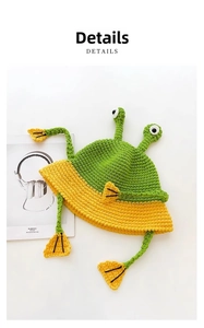 Close-up of green and yellow handmade crochet frog bucket hat with knitted 3D eyes