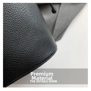 Close-up of black lychee grain leather texture on this stylish owl shoulder bag