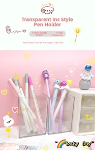 Close-up of clear acrylic desk organizers with cartoon pens and mini white storage cabinet