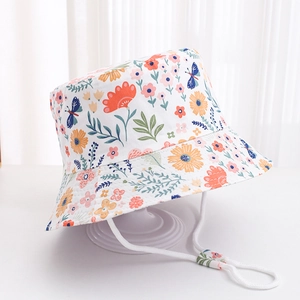 White kids bucket hat with floral butterfly print and adjustable chin drawstring strap