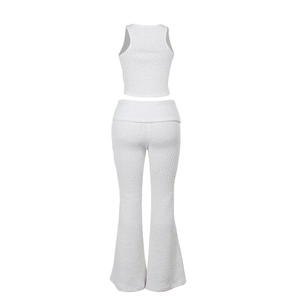 Rear view of white two-piece set featuring textured tank top and high-waisted flare pants