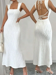 Detailed front and back view of white backless dress with textured wave fabric