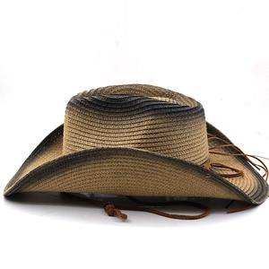 Detailed weave pattern of a western straw cowboy hat with gradient edges and tassels