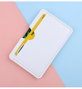 Close-up of slim white leather card holder with precise stitching and a single card slot