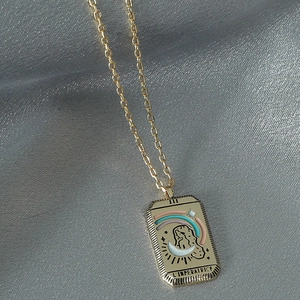 Vintage gold tarot card necklace featuring The Empress pendant with colorful enamel details