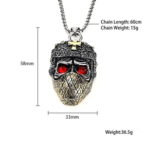 Gothic punk skull mask pendant with red gem eyes and gold cross on a 60cm chain