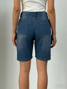 Women's high-waisted blue denim shorts with back pockets, classic slim fit style