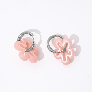 Detail of pink hollow floral earrings featuring silver hoops and resin flower petals