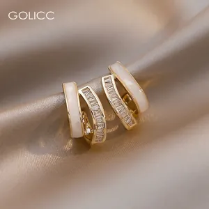 Elegant gold-plated double-layer hoop earrings with white enamel and baguette zircon stones