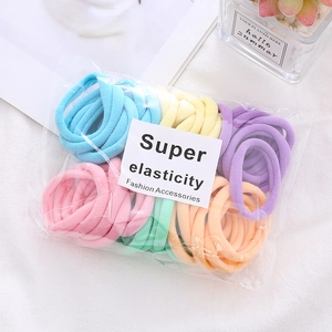 Macro shot of colorful seamless elastic hair ties in pastel macaron tones set