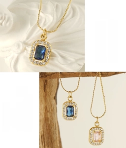 Detail of square zircon pendant on gold stainless steel chain with lead-free quality