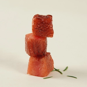 Realistic beef cube food model keychain featuring glossy texture and rosemary accent