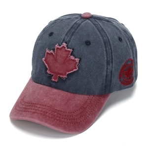 Washed navy and burgundy baseball cap with frayed red maple leaf embroidery detail