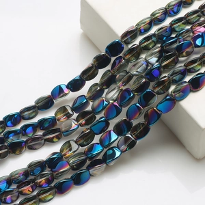 Macro detail of iridescent 10x12mm twisted glass beads for DIY jewelry making